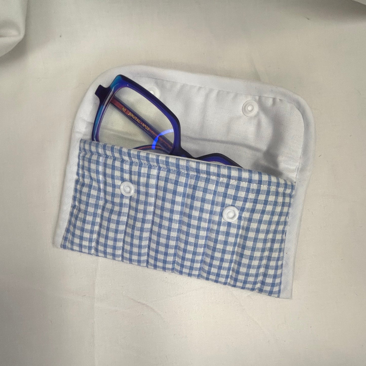 Blue and white checked glasses case