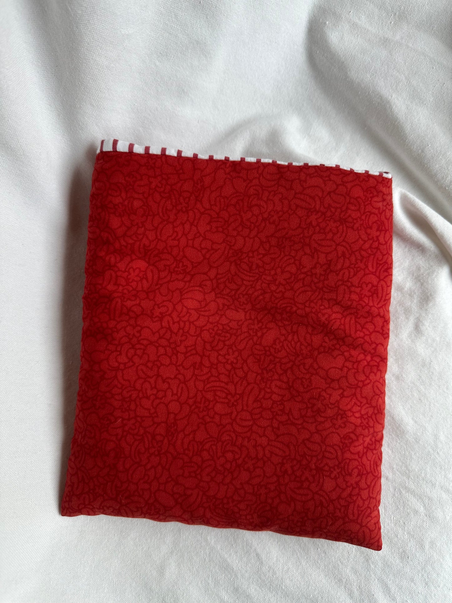 Red floral paperback book sleeve