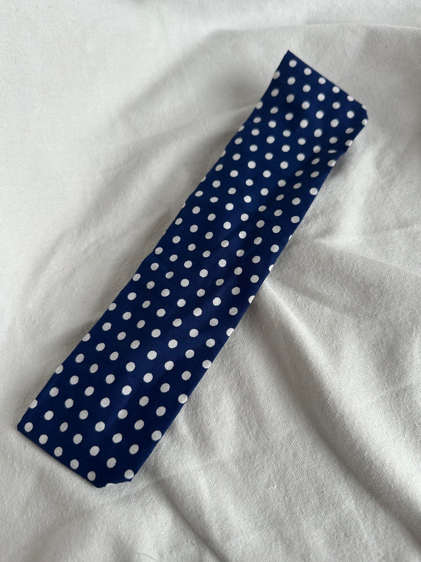 Blue headband with white polka dots